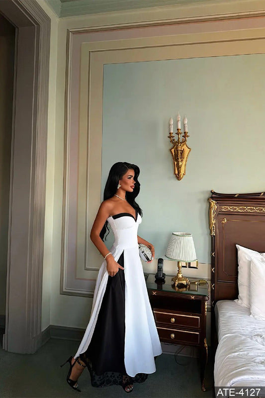 Two-tone white and black maxi dress with flared skirt and lace-trimmed hem