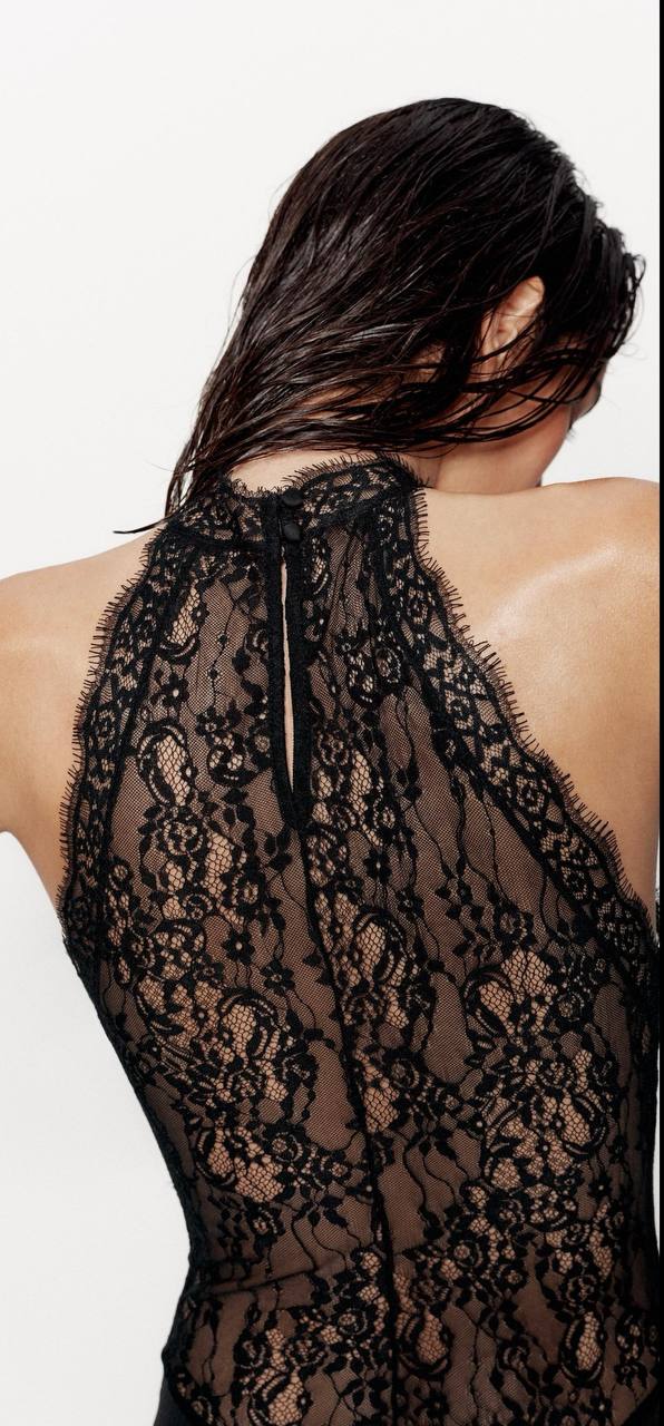 Back view of Veronica black halter maxi dress with lace neckline and keyhole button closure