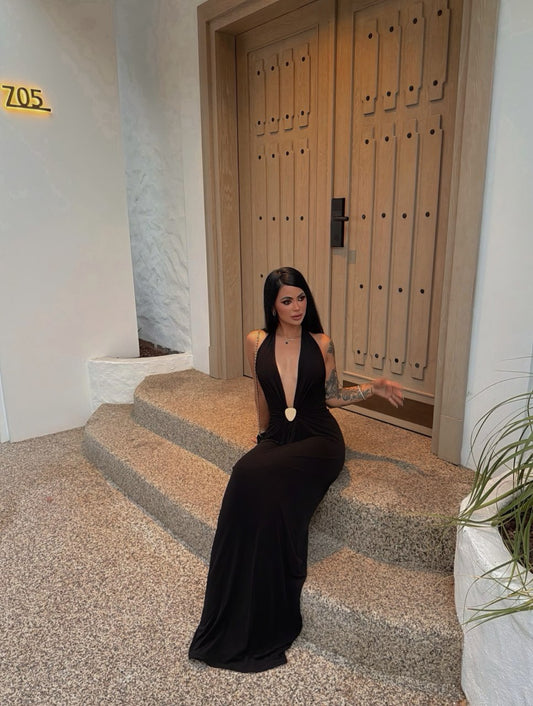 Black halter maxi dress with deep V-neckline and gathered waist detail